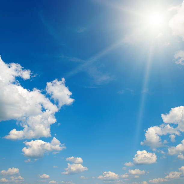 istock Bright sun on beautiful blue sky with white clouds. 1804626095