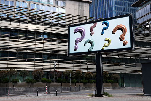 Colorful question marks on a street billboard