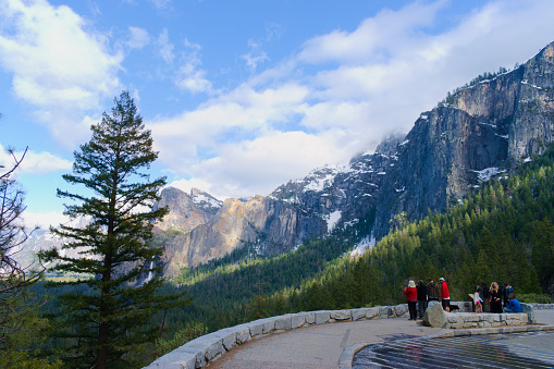 Yosemite, CA, USA, April, 13, 2023: People enjoy the beautiful view in the Tunnel of Yosemite National Park.