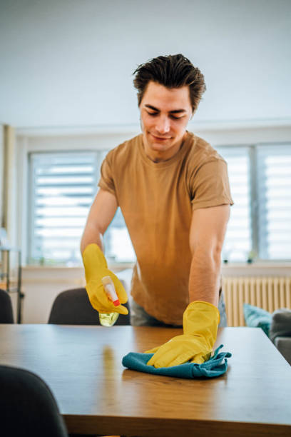 istock Man cleaning his home 1804664330