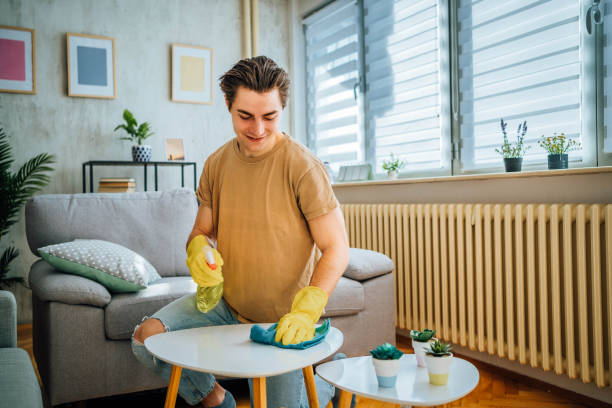 istock Man cleaning his apartment 1804664352