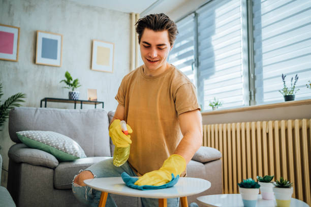 istock Man cleaning his apartment 1804664381