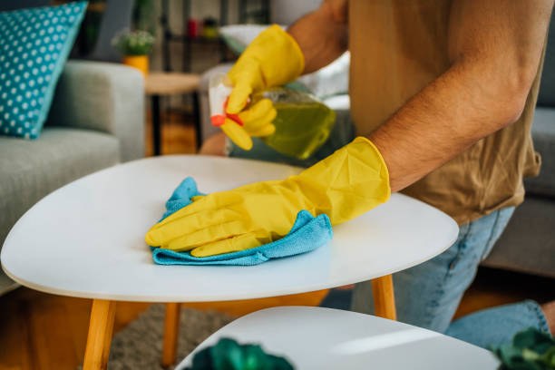 istock Man cleaning his apartment 1804664387