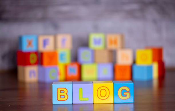 Wooden alphabet block with blog write