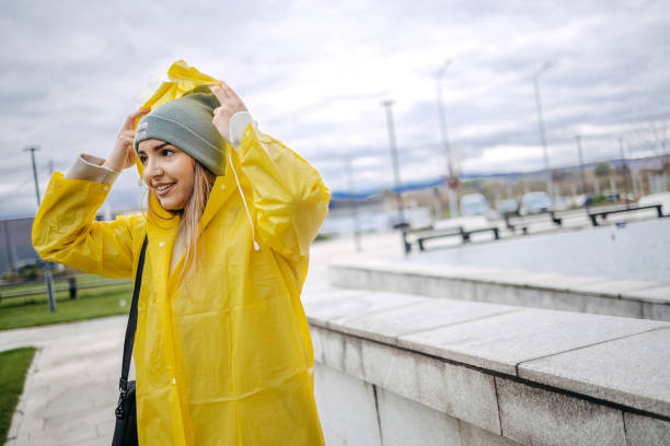 Free Stock Photo of A woman in a yellow jacket and hat | Download Free ...