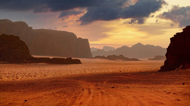 istock Panoramic wallpaper of Wadi Rum desert, Jordan. Rock formations and scattered clouds. 1804680205