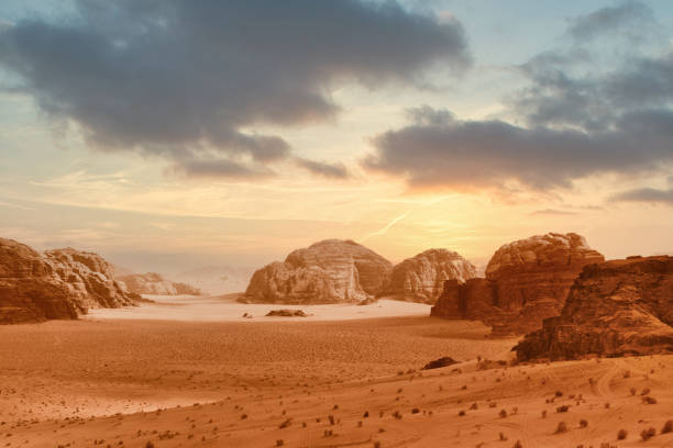 Wadi Rum, Jordan: Wadi Rum, also known as the Valley of the Moon, is a valley in southern Jordan, near the Saudi Arabian-Jordan border and about 60 km (37 mi) to the east of the city of Aqaba. With an area of 720 km2 (280 sq mi) it is the largest wadi in Jordan. Several prehistoric civilizations left petroglyphs, rock inscriptions and ruins in Wadi Rum. Today it is among one of Jordan's most popular tourist attractions. The Wadi Rum Protected Area has been a UNESCO World Heritage site since 2011.