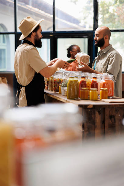 istock Salesman offers advice to customer 1804707767