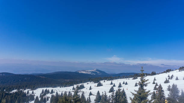 istock Panoramic view from the mountain top during winter season. 1804711473