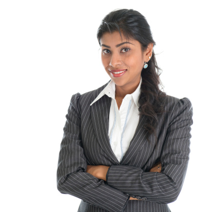 Portrait of beautiful African American businesswoman in business suit, isolated over white background. Mixed race Asian Indian and African American model.