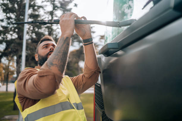 istock Truck driver makes repairs on vehicle 1804727626