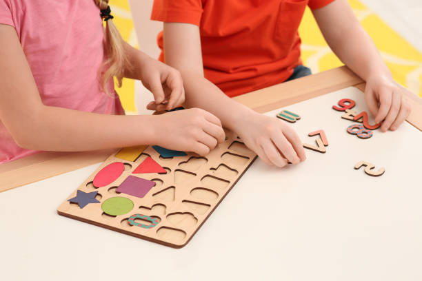 istock Children playing with math game kit at desk indoors, closeup. Learning mathematics with fun 1804741904