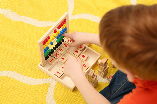 Playing With Math Child Playing With Math Game Kit On Floor Above View Learning ...