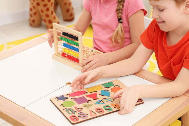 istock Children playing with different math game kits at desk indoors, closeup. Study mathematics with pleasure 1804743116