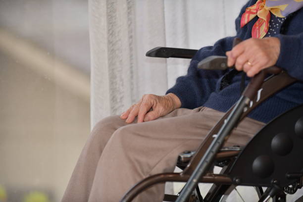 istock Senior woman sitting in a wheelchair 1804779310