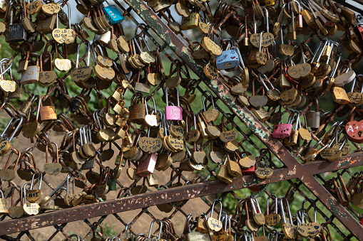 Love padlocks on a iron fence in Paris, France