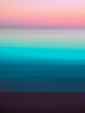 istock Romantic foggy motion blur sunset or sunrise landscape for soft warm-toned pastel seascape backgrounds 1804805480