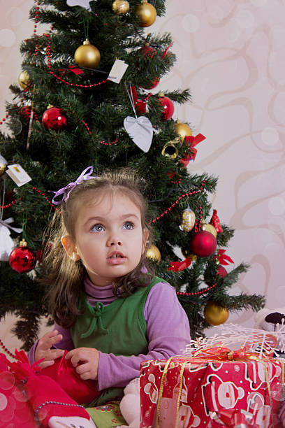 istock Cute little girl under Christmas tree 180481433