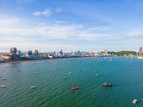Aerial view Pattaya city building sea beach with boat morning sunrise travel city sightseeing in Thailand