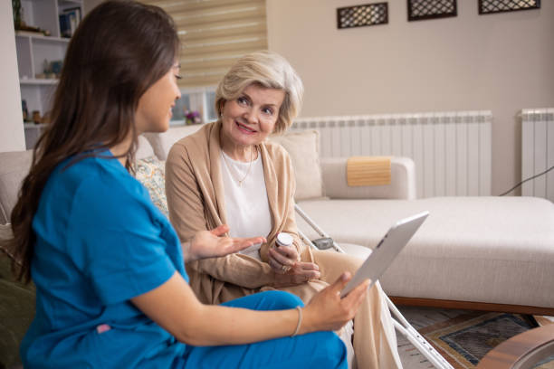istock Nurse helping senior woman 1804856290