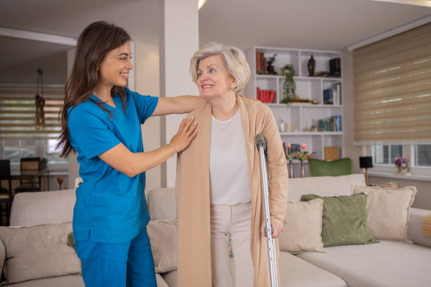 istock Nurse helping senior woman 1804856821