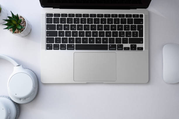 istock Laptop computer with a headphones and mouse from above 1804858461