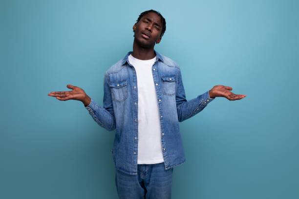 istock sad african man with dreadlocks in a denim jacket 1804859000