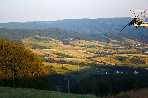 летние горы на закате - ski lift overhead cable car gondola mountain стоковые фото и изображения