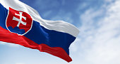 Close-up of Slovakia national flag waving in the wind on a clear day.