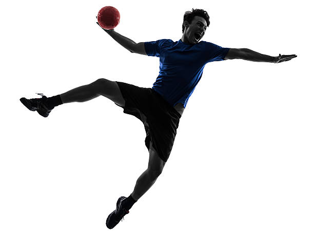 istock young man exercising handball player silhouette 180487250