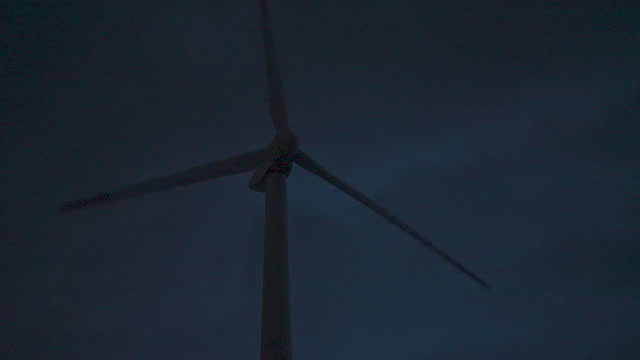 Thunderstorm over wind farm. Renewable energy concept. copy space