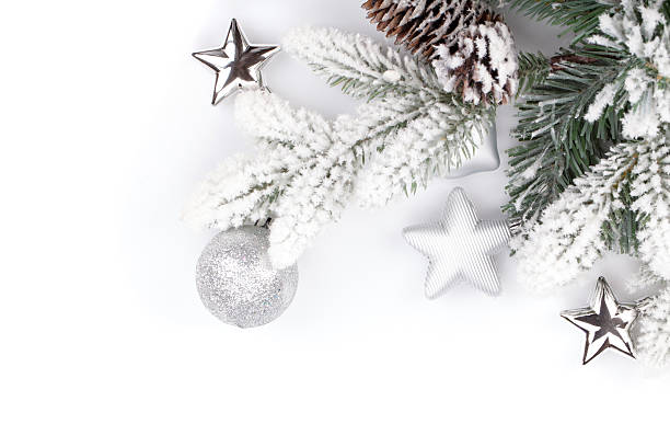 istock Fir tree branch with christmas decor covered by snow 180491111