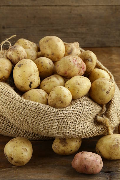istock fresh organic potatoes on a wooden background 180492426