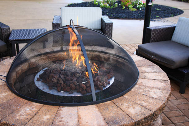 istock A Cozy Evening by the Fire: A Fire Pit Illuminates a Brick Patio 1804925286