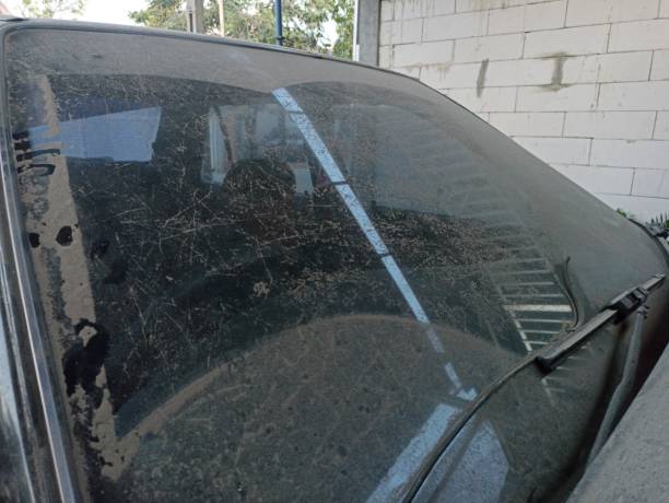 istock Dirty car windows. Dull glass with dust. 1804928573