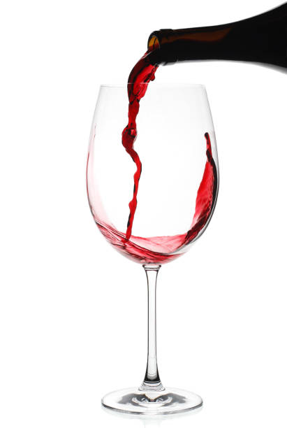 istock Pouring red wine in Bordeaux glass isolated 1804940295