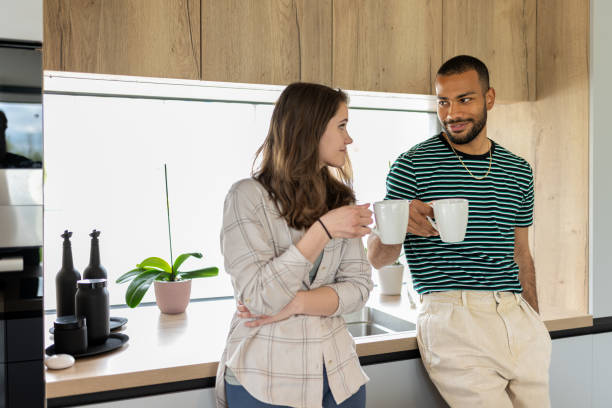 istock Young multiracial couple drinking coffee. 1804945997
