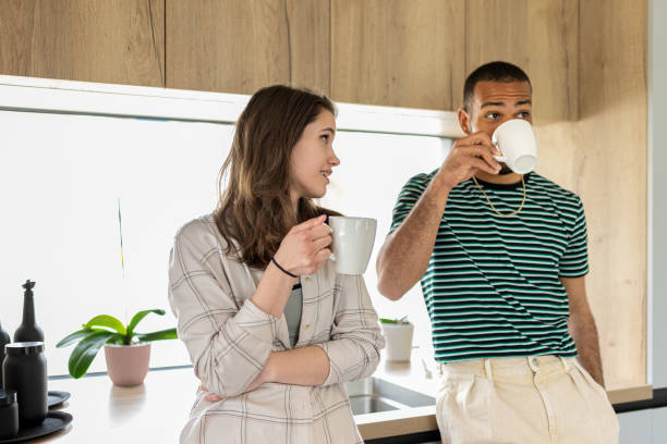istock Young multiracial couple drinking coffee. 1804946000