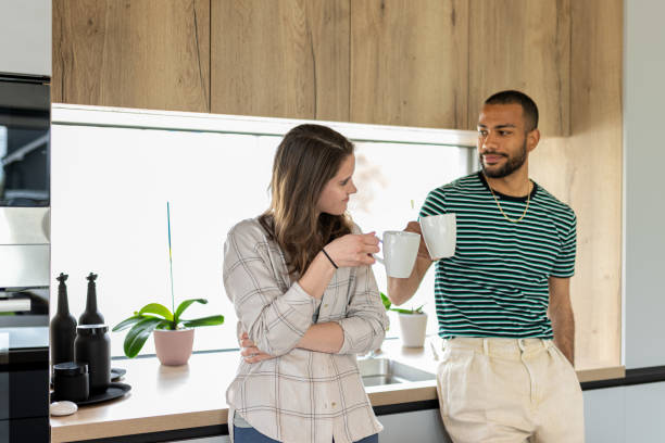 istock Young multiracial couple drinking coffee. 1804946002