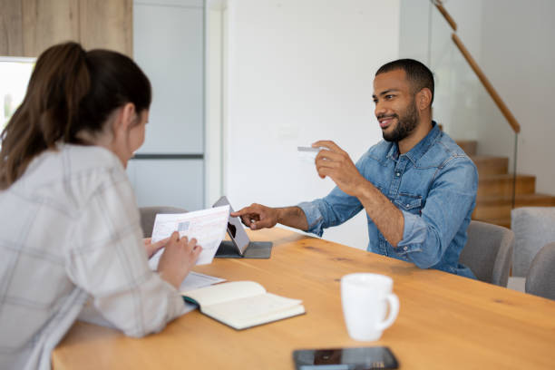 istock Multiracial couple paying bills online 1804947093