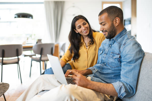 istock Multiracial couple paying bills online 1804947133