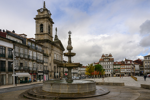 Guimaraes, Portugal - Nov 3, 2023: The Chafariz do Toural fountain in historical City Centre of Guimarães, a historic city located in the northwestern part of Portugal.