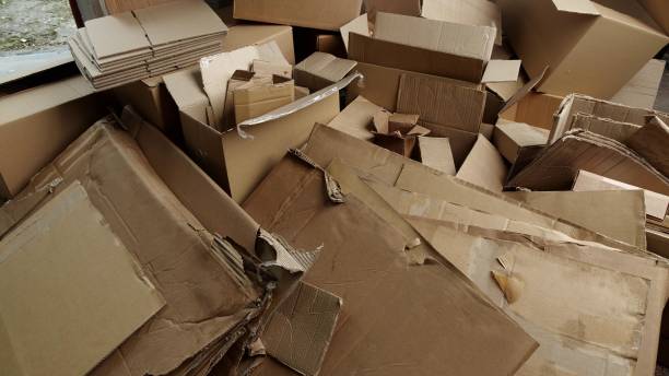 istock Used Cardboard Moving Boxes for Recycling. Paper packaging waste 1805005199