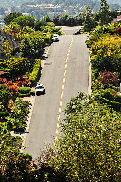 istock Road in the suburbs with nature around it 180502479