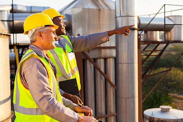 istock chemical factory workers 180502960