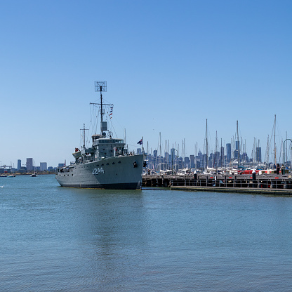 HMAS Castlemaine located in Williamstown with Melbourne City CBD in background