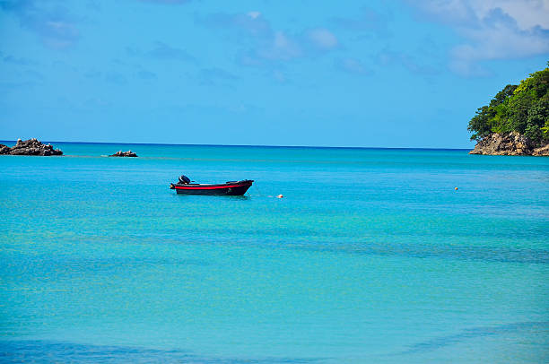 istock Boat in Turquoise and Blue Water 180505914
