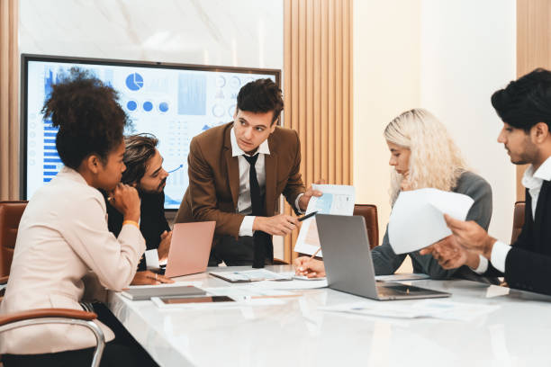istock Professional smart business team discussion about start up project. Ornamented. 1805110377
