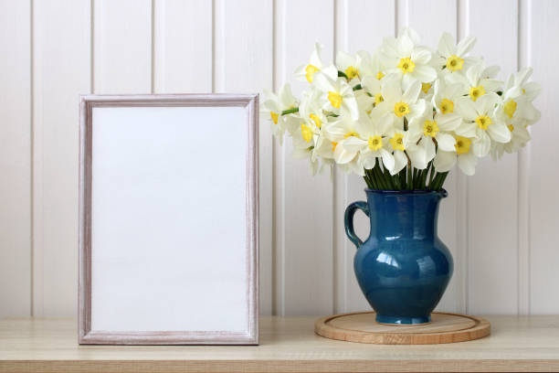 istock a bouquet with yellow daffodils, flowers and an empty space for your text. copy space. spring, rural composition, cottage core. empty frame. 1805117768