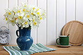 still-life, a bouquet of daffodils, garden flowers. concept: spring, rural composition, cottage core.